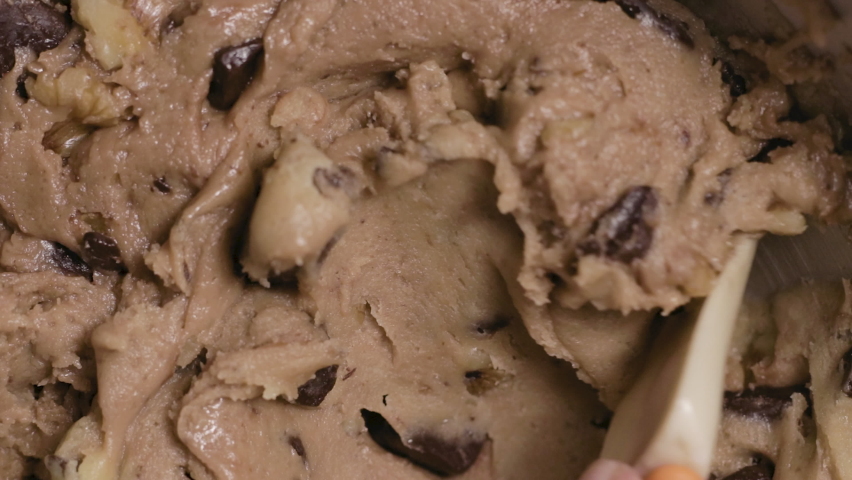 Close-up on Making and Mixing Chocolate Chip Cookies Dough, 4k Royalty-Free Stock Footage #1076626871