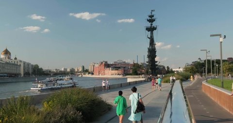Moscow, Russia - July 21, 2021: People walking in Muzeon park near Peter The Great Statue on Moskva River