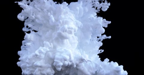 White paint drops in water on a black background, abstract and beautiful wave of ink. 8K downscale, slow motion. Filmed on cinema camera, 4K.