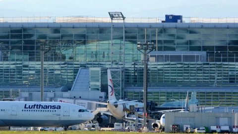 Frankfurt, Germany - May 2021: modern plane of the global aviation company Lufthansa rides along the airport building, tourism, concept, airplane, travel, air transportation of passengers, cargo