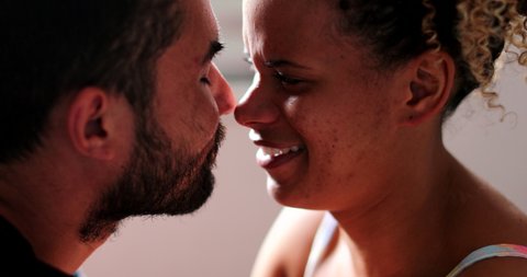 Hispanic couple eskimo kiss. latin american man and woman embrace