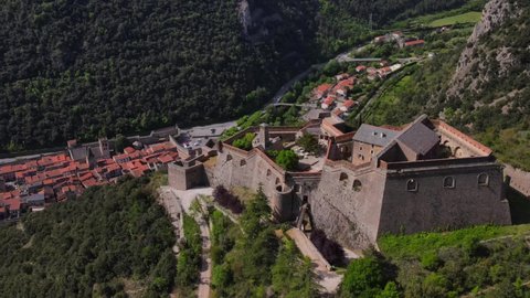 Villefranche-de-Conflent - France - June 10th 2021 - Aerial fly over of medieval village from the list of the most beautiful villages in France
