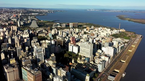 Porto Alegre, Rio Grande do Sul, Brazil - 07.27.2021 - Aerial view of landmark of brazilian city. Buildings at downtown city near Guaiba bay edge of Porto Alegre, Rio Grande do Sul, Brazil. Guaiba bay
