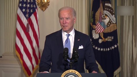 President Joe Biden delivers the oath of office to White House political appointees in a COVID-19 virtual event.