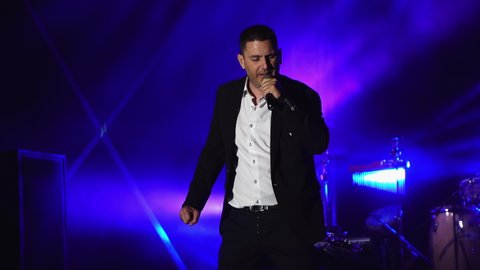 Bansko, Bulgaria - 08 Sep, 2019: Bulgarian Pop Folk singer Vasiil Ivanov on public concert in Bansko, Bulgaria