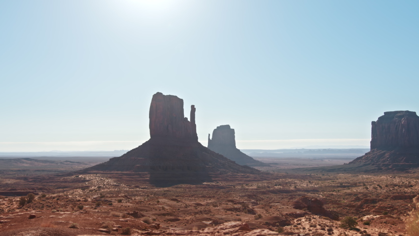 Happy Woman Nature Camping in the Canyon, Waken Up in the Orange Tent, Watching Sunrise above Monument Valley nature park. Female Traveler On a Wilderness Vacation Trip. Zoom Out Back View 4K footage