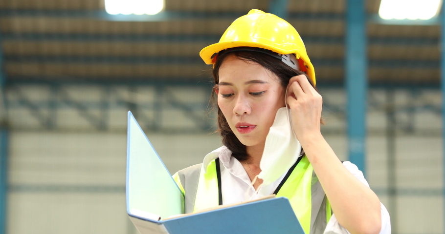 Working hard woman. warehouse woman worker waring protective face mask during coronavirus and flu outbreak.
