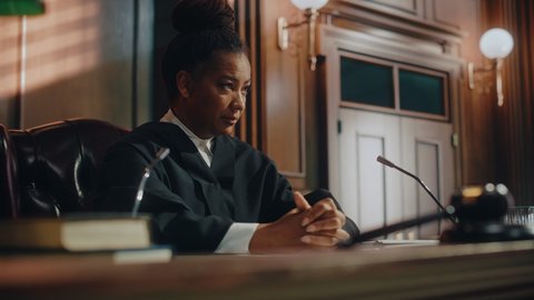 Court of Law Trial: Honorable Female Judge Discussing Pleaded Case, Explaining Her Deliberations, Decision of Guilty or Innocent Verdict after Hearing Arguments. Dramatic Speech of Wise Justice
