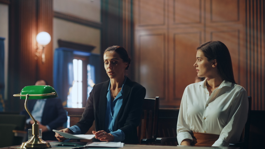 Court of Justice and Law Trial: Female Barrister Presenting Case, Making Passionate Speech to Judge, Jury. Multiethnic Attorney Lawyer Protecting Empowered Witness Against Crime, Injustice. Royalty-Free Stock Footage #1076688365