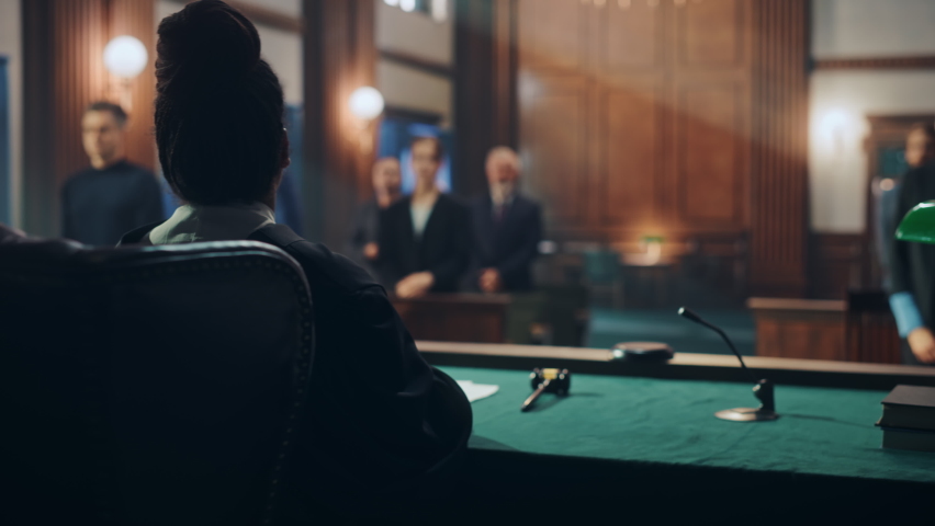 Cinematic Court of Law and Justice Trial: Female Judge Ruling Out a Decision in a Civil Family Case, Striking Gavel to Close Hearing. Convicted Male Defendant is Heartbroken, Lawyer Provides Support. | Shutterstock HD Video #1076688419