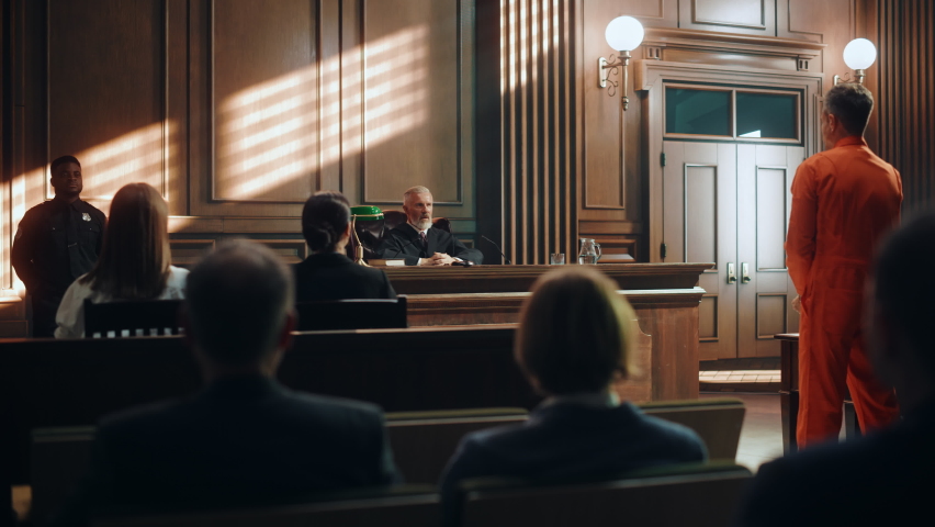 Court of Law and Justice Trial: Imparcial Honorable Judge Pronouncing Sentence, Striking Gavel. Cinematic Shot of Male Lawbreaker in Orange Robe Sentenced to Serve Time in Prison. Hearing Adjourned,