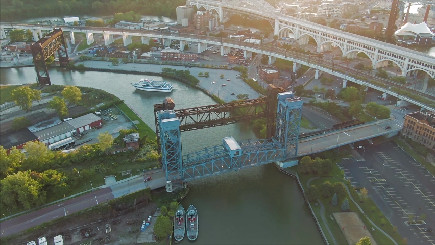 Aerial: Cuyahoga river and ferry boat at sunset. Cleveland, Ohio, USA 