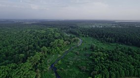 Metal railway train bridge over the river. Aerial footage from drone straight backward landscape revealing panorama