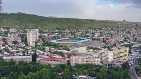 Yerevan Armenia on 5 July, 2021: Aerial view of the stadium in Yerevan, Armenia. Ararat Stadium is surrounded by houses and streets in the capital in the mountains.