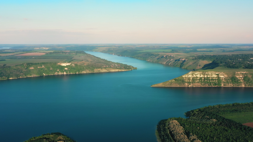 Wonderful Aerial View of the Hills Landscape and Wide River. Blue River surrounded by Rocky Hills. Beautiful View on wild Nature without People. Ukrainian Bakota. Bay. Drone. Ecology.