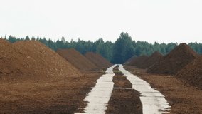 The long trail on the ground in the middle of the heap soil inside a quarry area in Estonia - Powered by Shutterstock - Get 15% off with code: PIKWIZARD15
