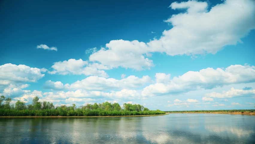 River Landscape In Sunny Spring Day Timelapse Transition To Dark Rain Clouds. Cloudy Sky With Clouds. Natural Background. Sky Before Rain. Rainy Sky Time-lapse 4K Royalty-Free Stock Footage #1076710196