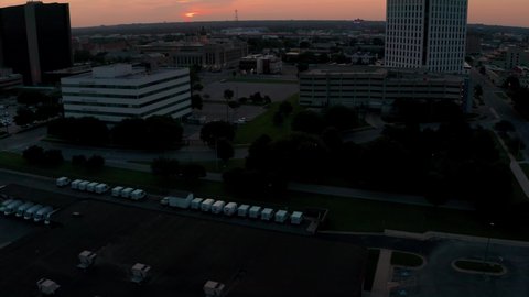 Drone reveal shot of sunrise cityscape in downtown Wichita Kansas 4k