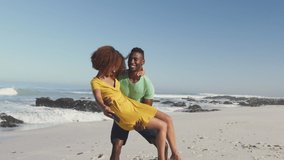Animation of happy african american couple having fun at beach using smartphone, over white spots. communication technology and keeping in touch, digitally generated video.
