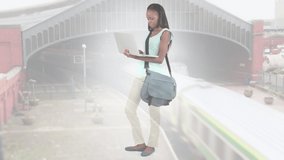 Animation of african american woman standing using laptop over cityscape. out and about in the city, digitally generated video.