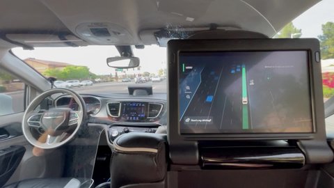 Tempe, Arizona - March 29 2021: a driverless vehicle uses LIDAR to map traffic then take a corner as part of Waymo and Lyft's live pilot programme
