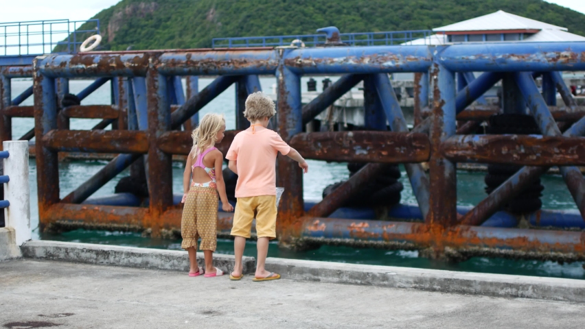 Pier, docks, rusty pipes and childs