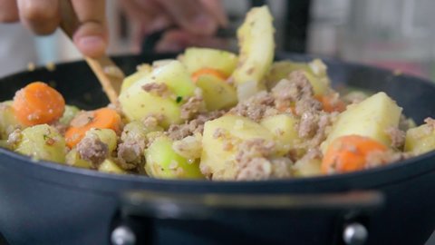 Vegetable stew with minced meat and spices. Slices of stewed vegetables. Slow motion
