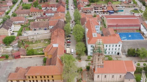 Aerial shot flying along a street in Novi Sad, Serbia in a residential area.