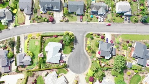 flying over a suburban neighborhood with several cul-de-sacs and colorful landscaping in Oregon