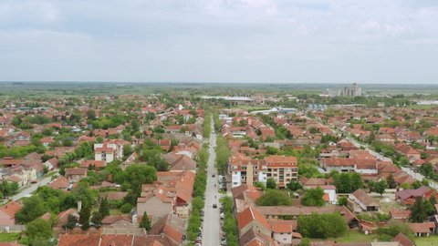 Aerial shot dollying back away from a residential area of Novi Sad, Serbia on an overcast day.