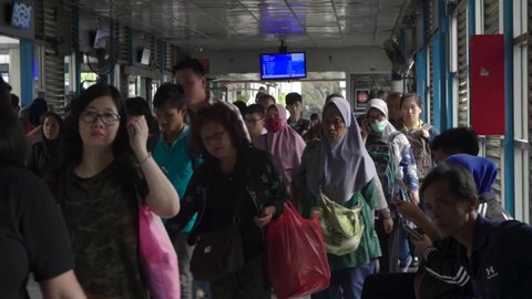Jakarta, Indonesia-June 26, 2021: Crowded atmosphere of Trans Jakarta bus passengers in the morning