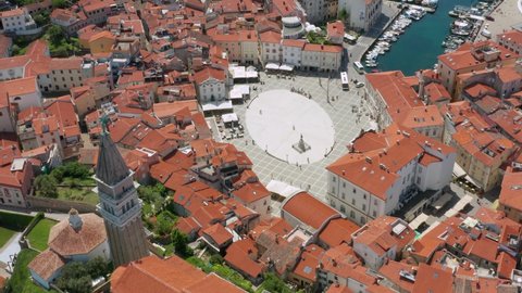 Bell Tower Of St. George's Parish Church With Overview Of Tartini Central Square In Piran, Slovenia. aerial