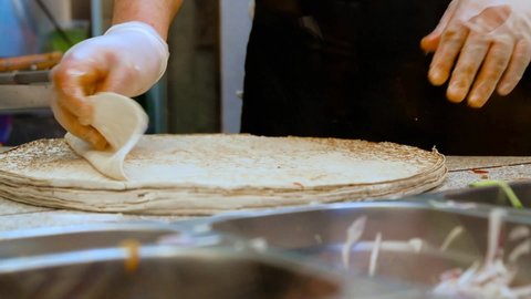 Mayonnaise and ketchup on pita bread. Cooking process shawarma