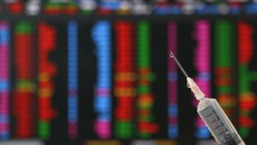 Syringe fill with covid-19 vaccine with stock exchange board background , concept vaccine can help economic recovery. - Powered by Shutterstock - Get 15% off with code: PIKWIZARD15