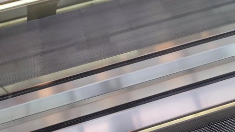Close up of empty steps of an escalator in a perspective view.