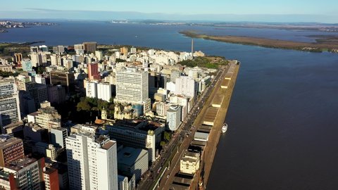 Porto Alegre, Rio Grande do Sul, Brazil 07.28.2021 - Aerial landscape of coast downtown city of Porto Alegre at sunny day, state of Rio Grande do Sul, Brazil. Guaiba River Harbor. Guaiba River Edge. 