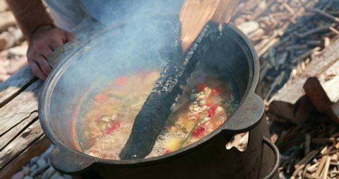 Traditional soup is cooked in a saucepan.
The Cook prepares fish. Traditional Russian fish soup.
Food being cooked in a saucepan.