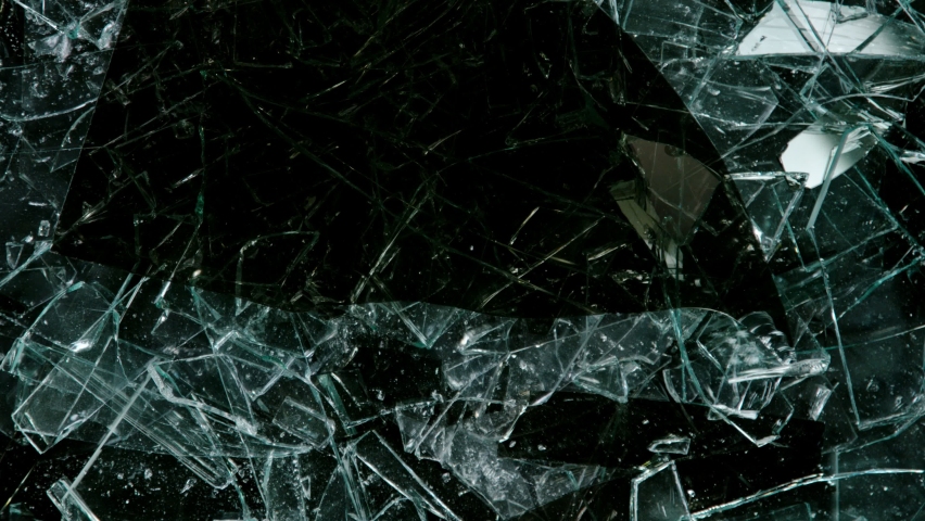 Super Slow Motion Shot of Real Glass Break. Isolated on Black Background. Royalty-Free Stock Footage #1076769689