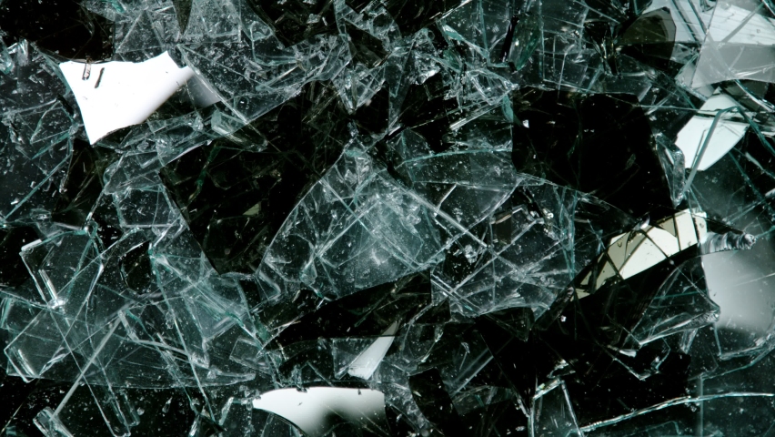 Super Slow Motion Shot of Real Glass Break. Isolated on Black Background. Royalty-Free Stock Footage #1076769689