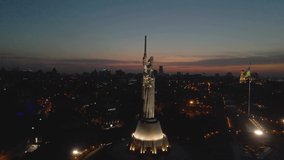 Motherland monument Ukraine Kiev night flight by drone lighting