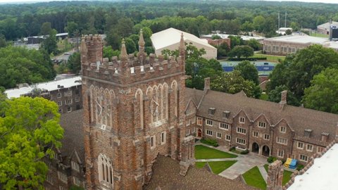 Durham , NC , United States - 06 12 2021: Aerial of Duke University campus tower. Gothic architecture and tennis courts.