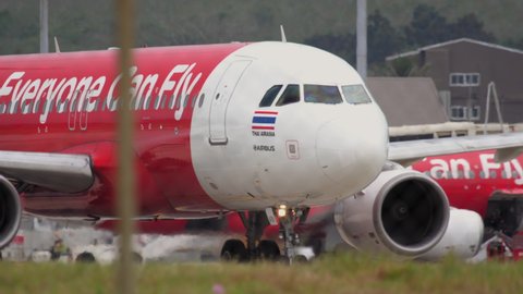 PHUKET, THAILAND - DECEMBER 1, 2016: AirAsia Airbus 320 HS-ABI taxiing before departure from Phuket International airport