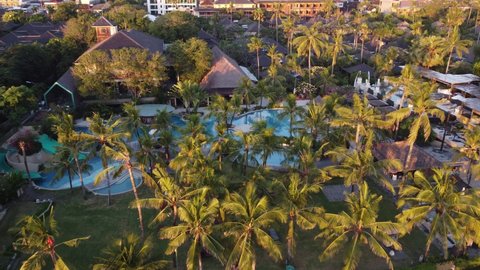 Bali, Indonesia - CIRCA 2021: Aerial Drone View of Kuta Legian Resort Town Hotel Swimming Pool