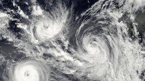 Triple hurricane storm, tornado top view. Elements of this video furnished by NASA. Animation of giant hurricane seen from outer space