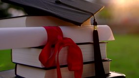 Cinematic Graduation B-Roll With Cap, Certificate And Books At Sunset - Powered by Shutterstock - Get 15% off with code: PIKWIZARD15