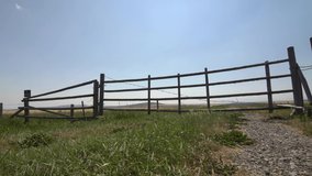 Slider motion of a farmyard gate on the Canadian prairies in Southern Alberta.