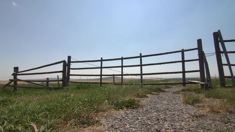Slider motion of a farmyard gate on the Canadian prairies in Southern Alberta.