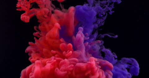 Color red and blue paint drops in water with black background , abstract color mix , drop of ink,  paint falling on water. 8K downscale, slow motion. 4K.