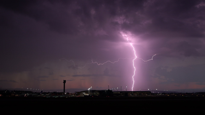 Lightning strikes airport late evening rainshowers slow motion