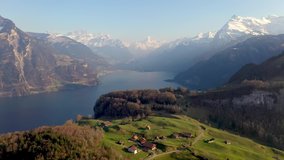 Dramatic aerial drone footage of the Seelisberg village by lake Lucerne in the alps in Switzerland. Shot with a rotation motion
